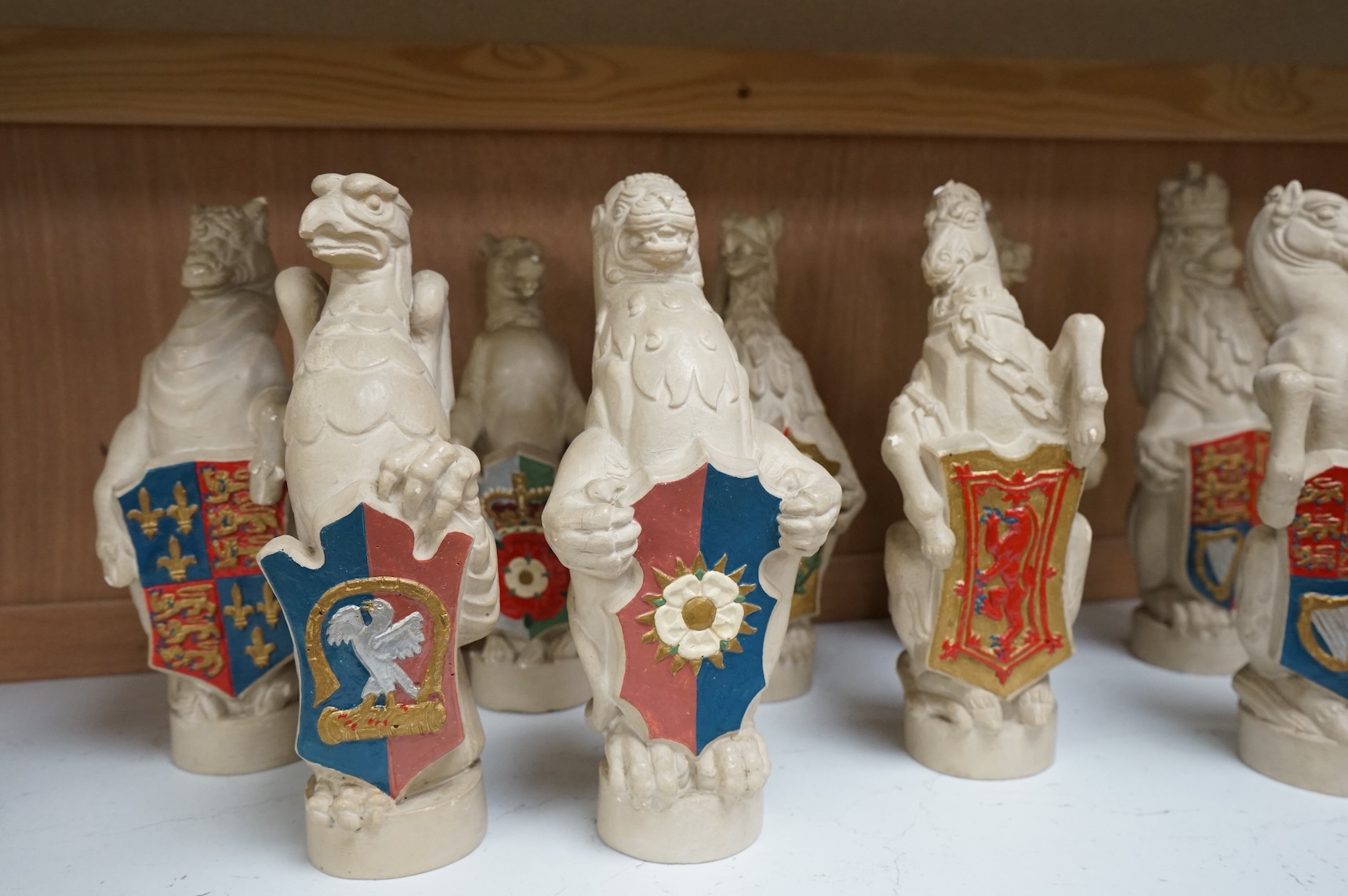 James Woodford, ten painted plaster figures of the Queen's Beasts, inscribed and dated 1953, 26cm high